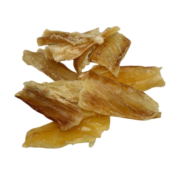 Dried fish pieces on a white background