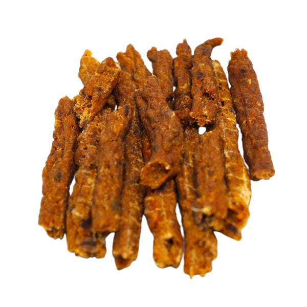 Dried ginseng roots on a white background