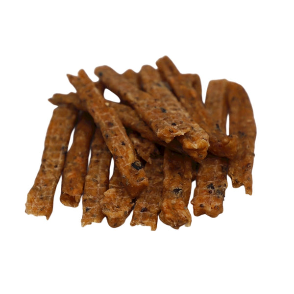 Brown dog treats on a white background