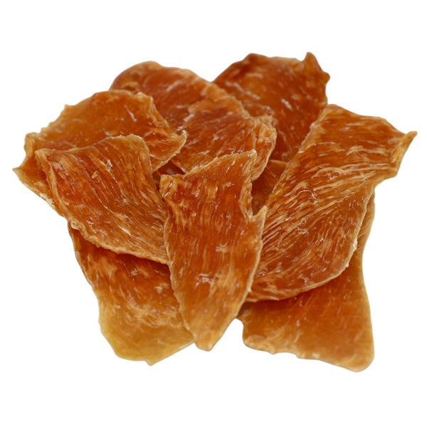 Dried ginger pieces on a white background